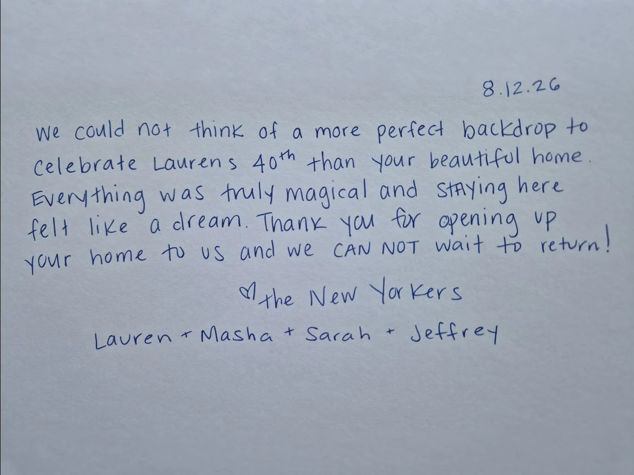 A handwritten message from guests in the Pura Vida guestbook